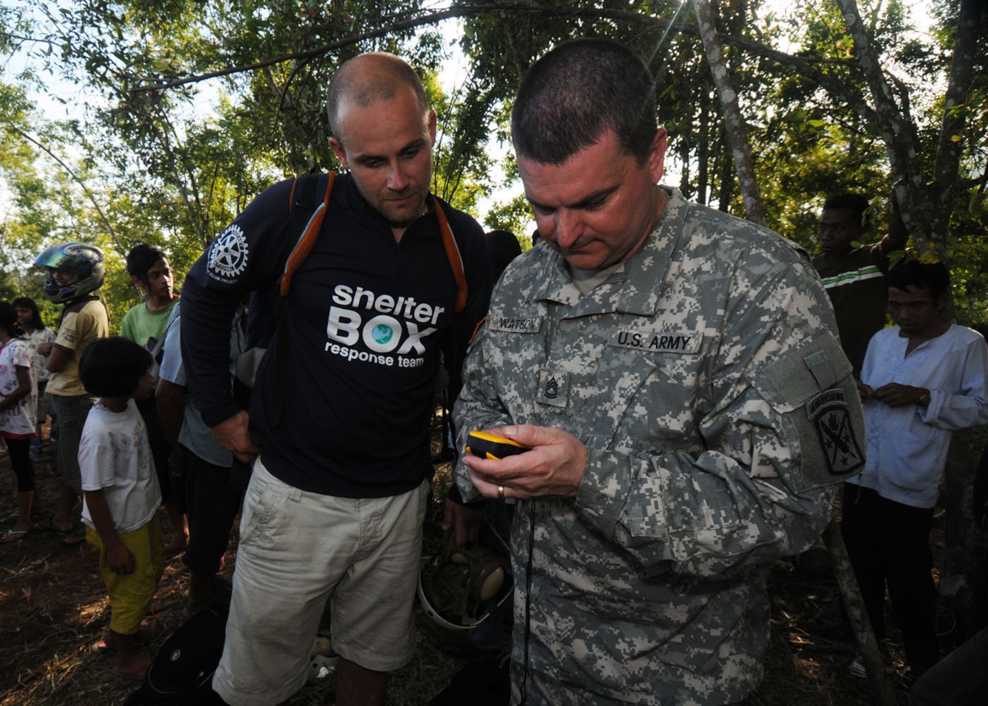 Army Sgt. 1st Class Justin Watson (right), 97th Civil Affairs Battalion at Fort Bragg, N.C., and Shane Ravill, a ShelterBox Trust volunteer, plot coordinates on a global positioning system Oct. 11. ShelterBox Trust, an international disaster relief charity that delivers emergency shelters to people affected by disasters, donated emergency shelter boxes following earthquakes that struck Indonesia Sept. 30. Each box contains a ten person tent, multi-fuel stove, blankets, water purification tablets, basic tools and cookware among others. The U.S. military, including a 71-member Air Force Humanitarian Assistance Rapid Response Team, is also in Indonesia assisting in relief efforts throughout Indonesia. (U.S. Air Force photo/ Staff Sgt. Veronica Pierce)