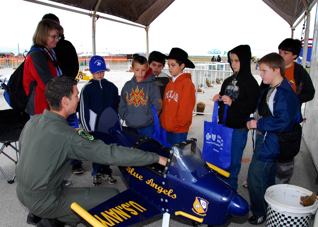 Parents help their children line up along the runway and prepare for takeoff
at the Sheppard Open House and Air Show Oct. 10. This year's air show Oct.
10-11 brought in about 16,000 visitors Saturday and 7,000 visitors Sunday to
Sheppard this weekend. 

