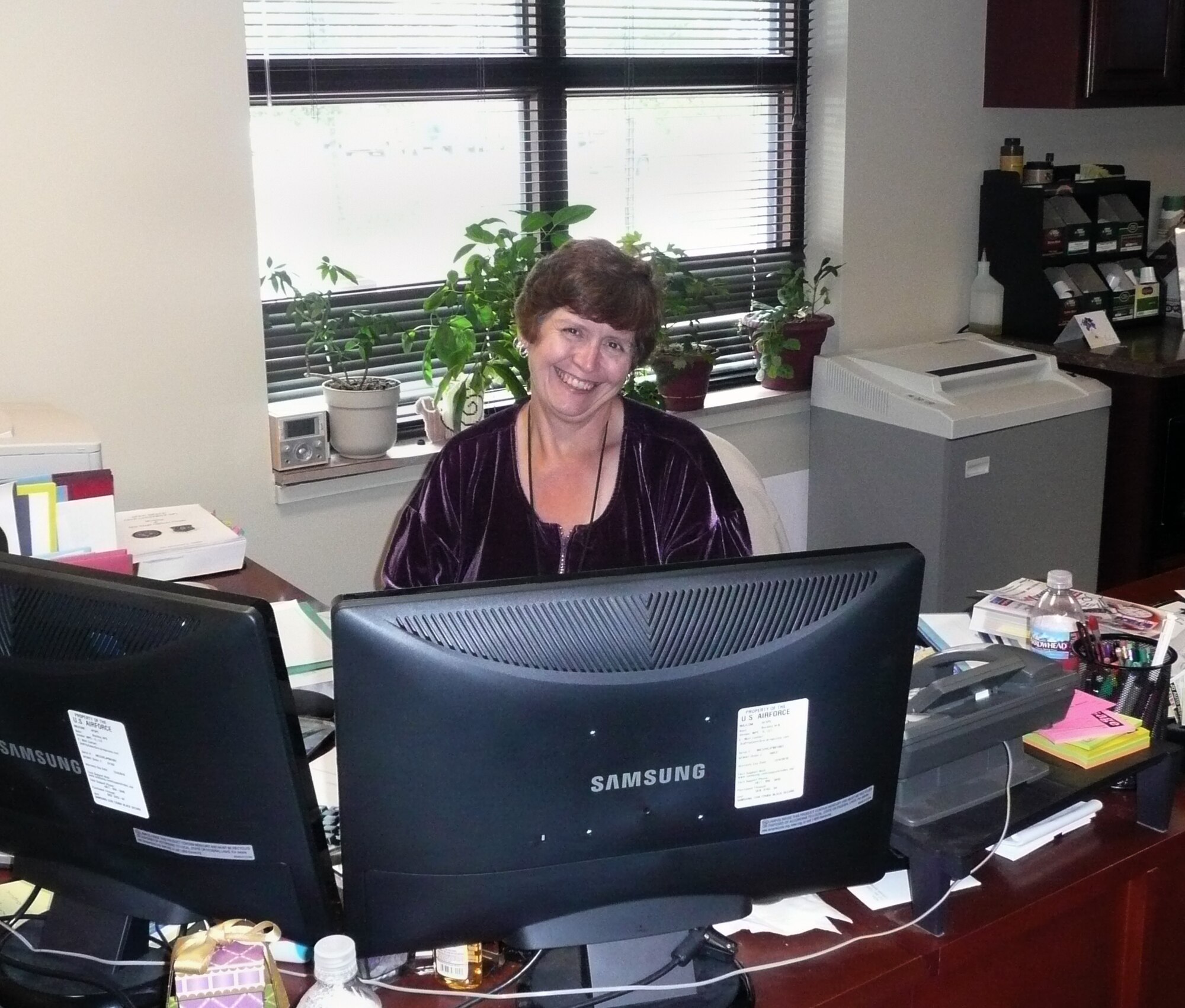 WARRIOR OF THE WEEK – Ms. Esther Benjamin, 460th Mission Support Group, pictured at her desk, is Team Buckley’s Warrior of the Week for Oct. 12. (courtesy photo)