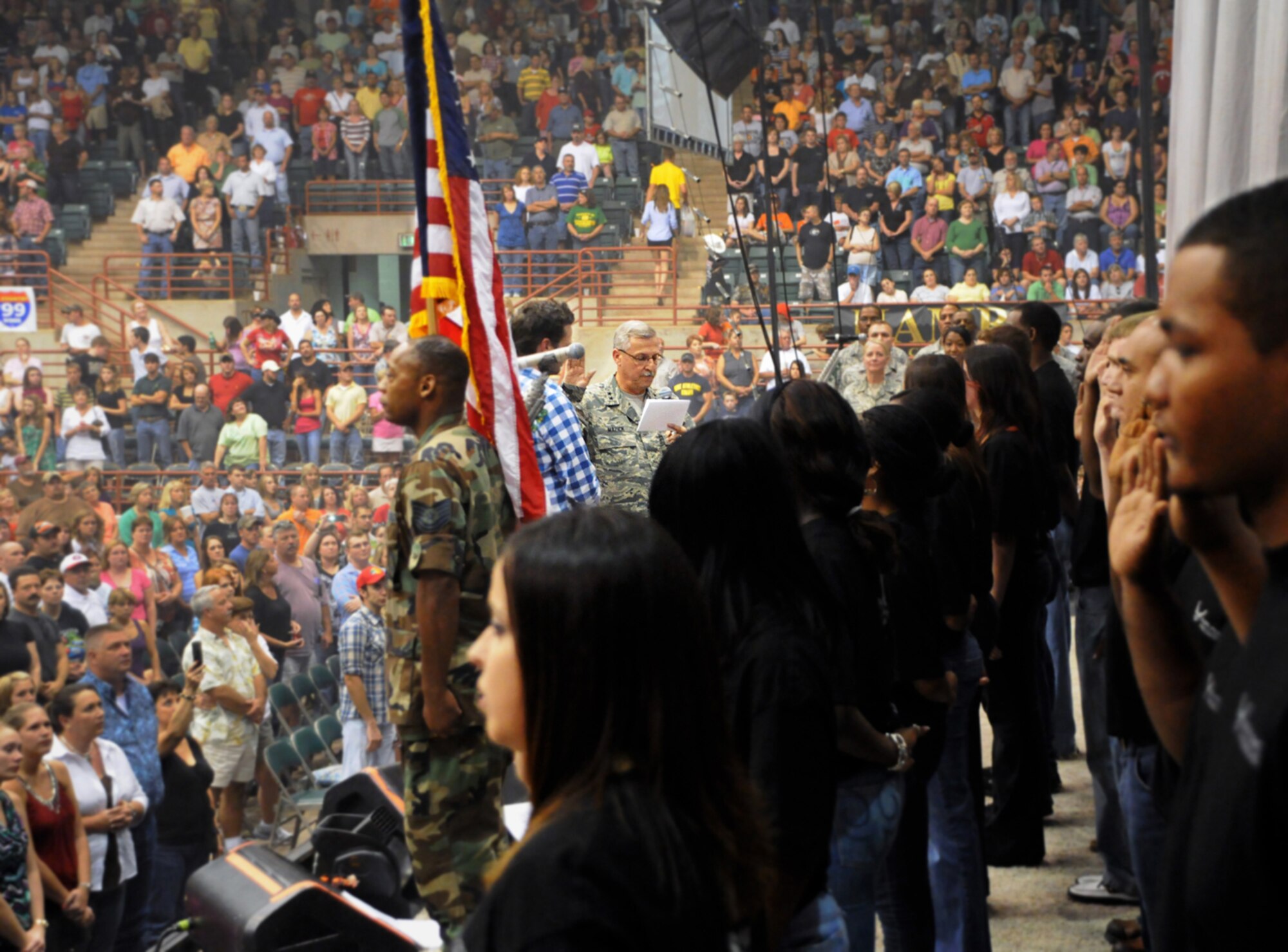 Twenty-four new recruits take the oath of enlistment from Maj. Gen. Martin M. Mazick, Air Force Reserve Command vice commander, during a mass enlistment ceremony Oct. 10, 2009, at the Georgia National Fairgrounds in Perry, Ga. (U.S. Air Force photo/Tech. Sgt. Paul Flipse)

