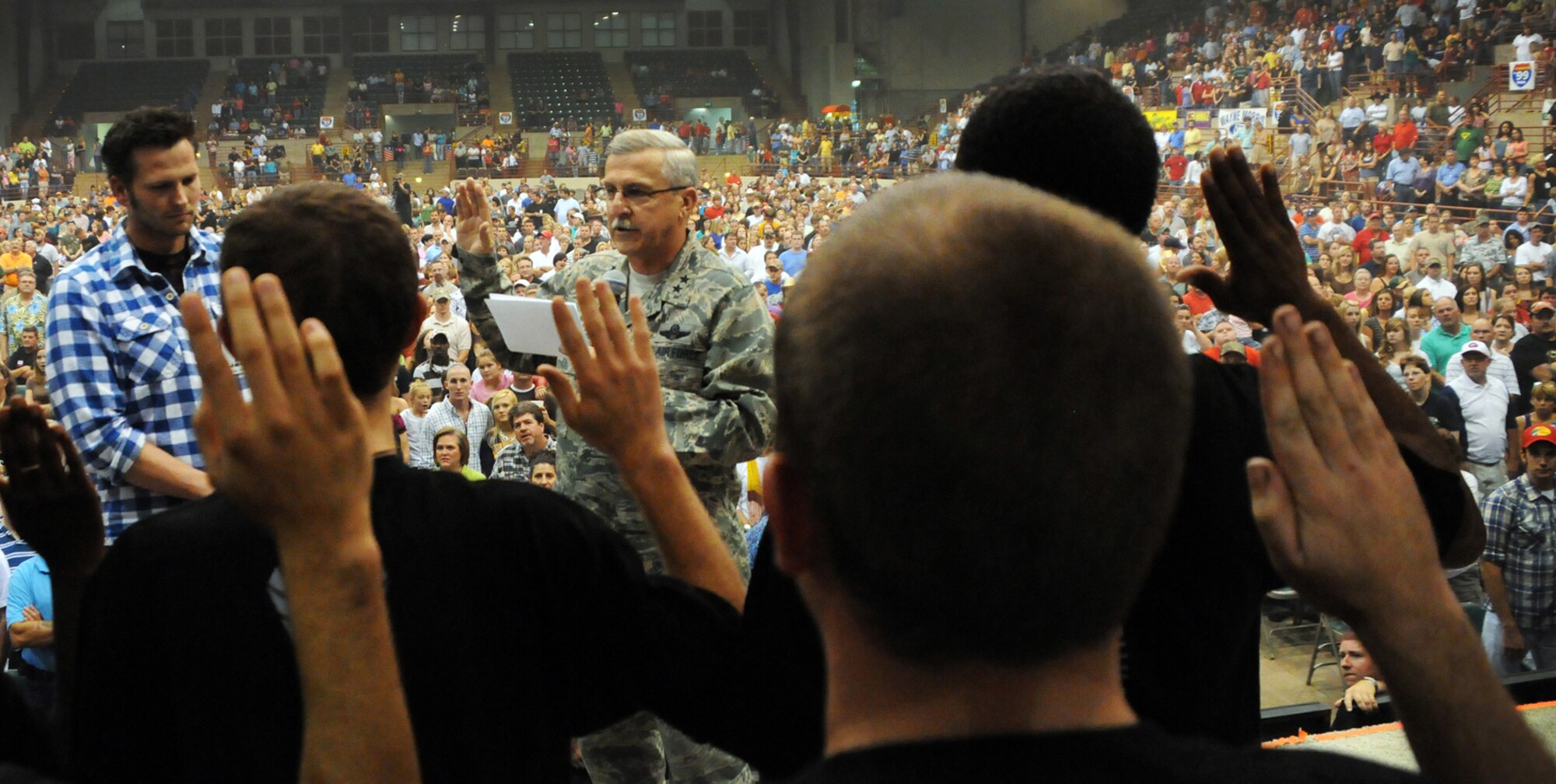 Maj. Gen. Martin M. Mazick, Air Force Reserve Command vice commander, administers the oath of enlistment to 24 new recruits during a mass enlistment ceremony at the Georgia National Fairgrounds in Perry, Ga., Oct. 10, 2009.  . (U.S. Air Force photo/Tech. Sgt. Paul Flipse)
