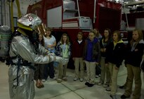 MINOT AIR FORCE BASE, N.D. -- Students from Bishop Ryan High School, a school in Minot, learn about the function and practicality of the base fire department’s mission, here Oct. 8. The tour is just one way Minot AFB reaches out to the community to show how the base supports the Air Force’s mission around the world. The students also visited the 54th Helicopter Squadron, the 5th Security Forces Squadron military working dogs and a B-52H Stratofortress static display. (U.S. Air Force photo by Senior Airman Michael Veloz)
