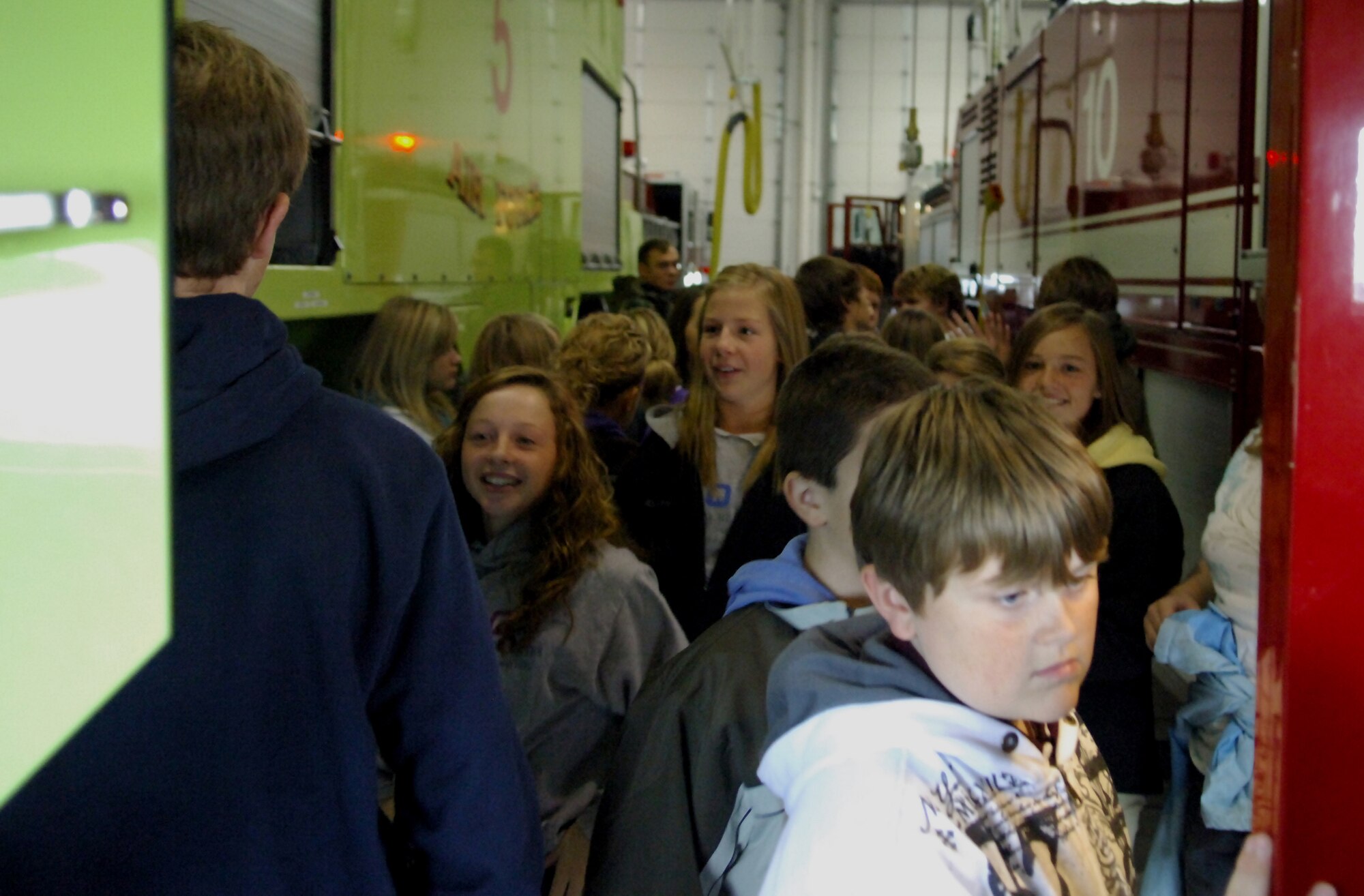 MINOT AIR FORCE BASE, N.D. -- Students from Bishop Ryan High School, a school in Minot, learn about the function and practicality of the base fire department’s mission, here Oct. 8. The tour is just one way Minot AFB reaches out to the community to show how the base supports the Air Force’s mission around the world. The students also visited the 54th Helicopter Squadron, the 5th Security Forces Squadron military working dogs and a B-52H Stratofortress static display. (U.S. Air Force photo by Senior Airman Michael Veloz)