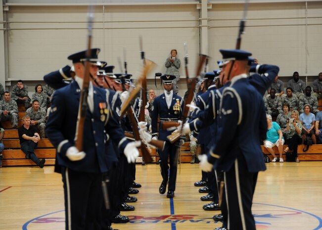 The Air Force Honor Guard Drill Team performs at the Fitness and Sports Center here Oct. 9. To maintain continuity of drill proficiency, all Drill Team members serve a minimum of two-years when assinged to the Drill Team. (U.S. Air Force photo/Senior Airman Katie Gieratz)