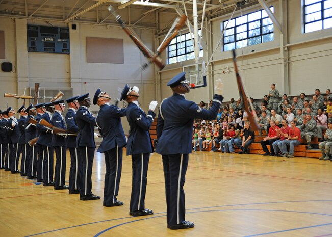 The Air Force Honor Guard drill team performs at the Fitness and Sports Center here Oct. 9. Throughout the year, the Drill Team works with the Air Force Recruiting Service to provide Air Force presence to hundreds of locations. (U.S. Air Force photo/Senior Airman Katie Gieratz)
