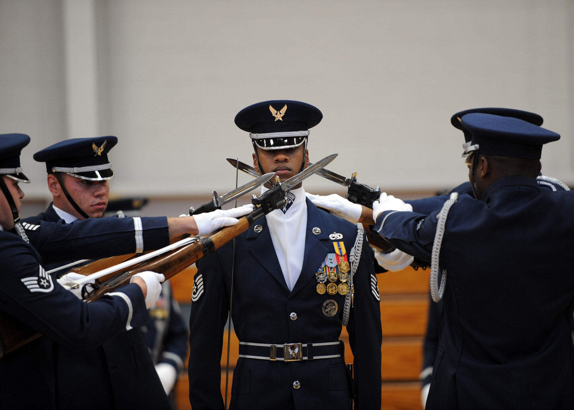 The U.S. Air Force Honor Guard Drill Team performs at the Fitness and Sports Center here Oct. 9. The team is the traveling component of the Air Force Honor Guard and inspires Air Force awareness among military and civilian audiences through its complex drill routine. The team tours various Air Force bases, civilian events involving the Air Force and local communities and schools across the globe, as well as spends substantial time providing community performances to the thousands visiting the nations capital at various monuments in Washington D.C. (U.S. Air Force photo/Senior Airman Katie Gieratz)