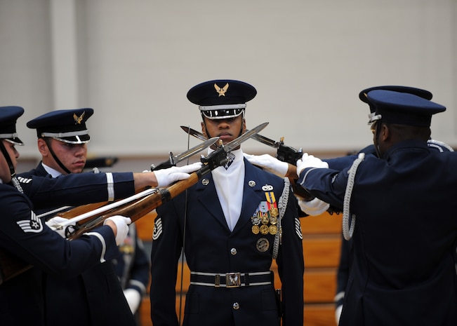 The U.S. Air Force Honor Guard Drill Team performs at the Fitness and Sports Center here Oct. 9. The team is the traveling component of the Air Force Honor Guard and inspires Air Force awareness among military and civilian audiences through its complex drill routine. The team tours various Air Force bases, civilian events involving the Air Force and local communities and schools across the globe, as well as spends substantial time providing community performances to the thousands visiting the nations capital at various monuments in Washington D.C. (U.S. Air Force photo/Senior Airman Katie Gieratz)