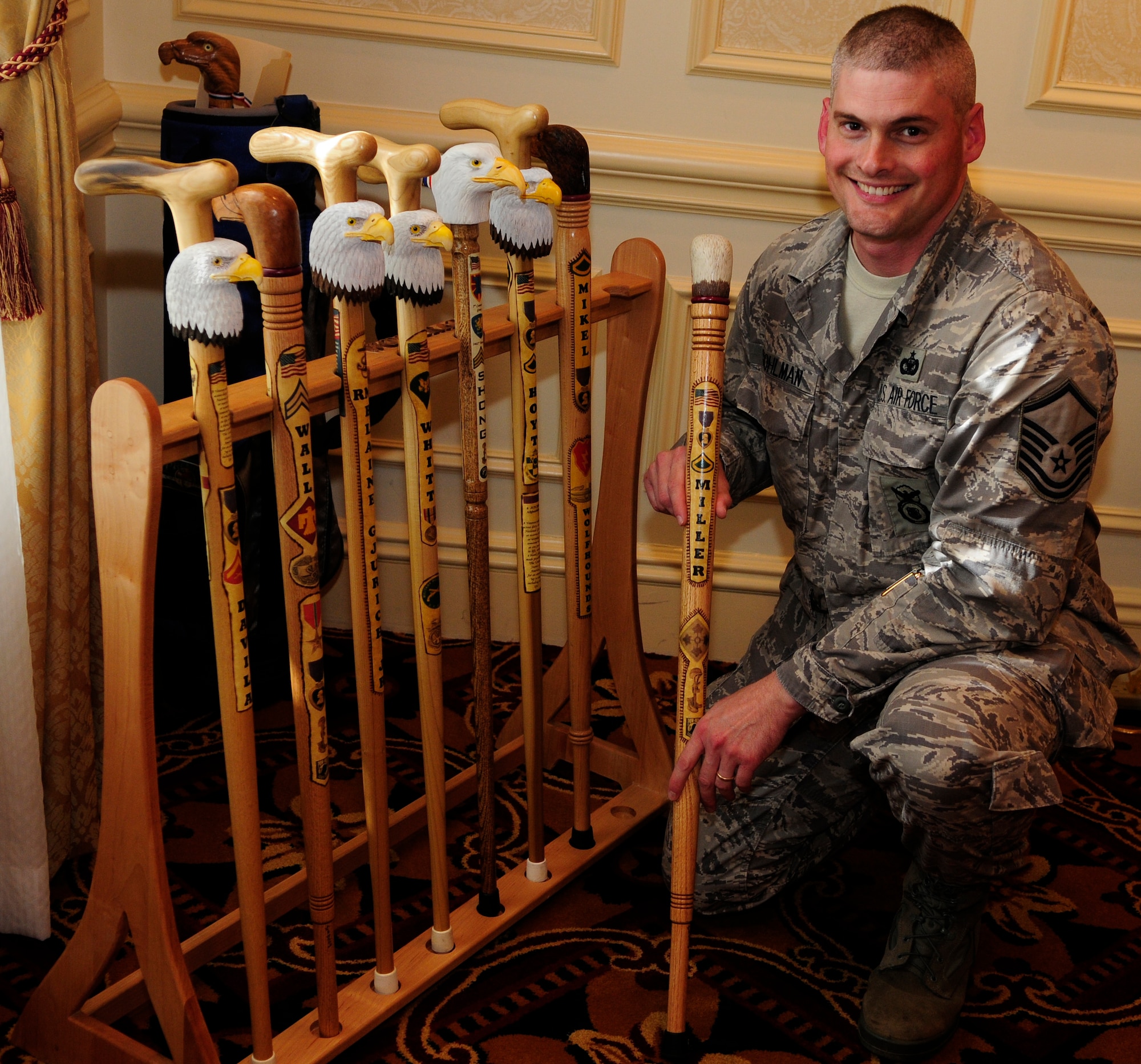 Master Sgt. Bruce Stohlman, Jr., Bolling Air Force Base Joint Visitors’ Center superintendent, poses with several finished eagle head canes Oct. 7 at the Walter Reed Medical Center in Washington, D.C. Sergeant Stohlman volunteers his woodworking skills hand-carving canes for wounded veterans with the Northern Virginia Woodcarvers as part of the Eagle Cane Project. The Eagle Cane Project is an off-shoot of Soldiers’ Angels, a non-profit organization providing aid and comfort to United States servicemembers and their families. (U.S. Air Force photo by Airman 1st Class Susan Moreno)