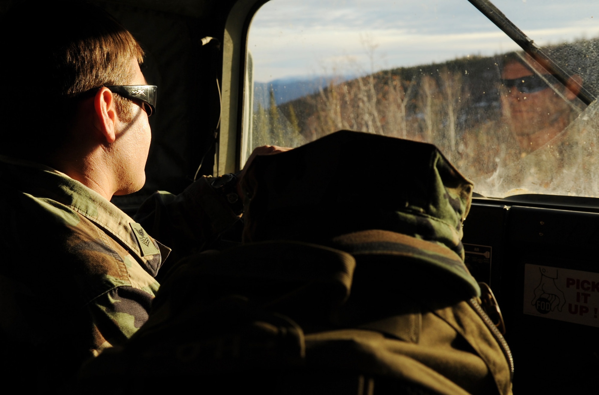 Navy Petty Officer 1st Class Nathan Crossett navigates the humvee out to the Joint Pacific Alaskan Range Complex during RED FLAG-Alaska 10-1 Oct. 7, 2009, Eielson Air Force Base, Alaska. RF-A is a Pacific Air Forces-directed field training exercise for United States and coalition forces under simulated combat conditions. Petty Officer Crossett is a joint terminal air controller assigned to the Naval Amphibious Base Little Creek, Virginia. (U.S. Air Force photo/Airman 1st Class Laura Goodgame) 