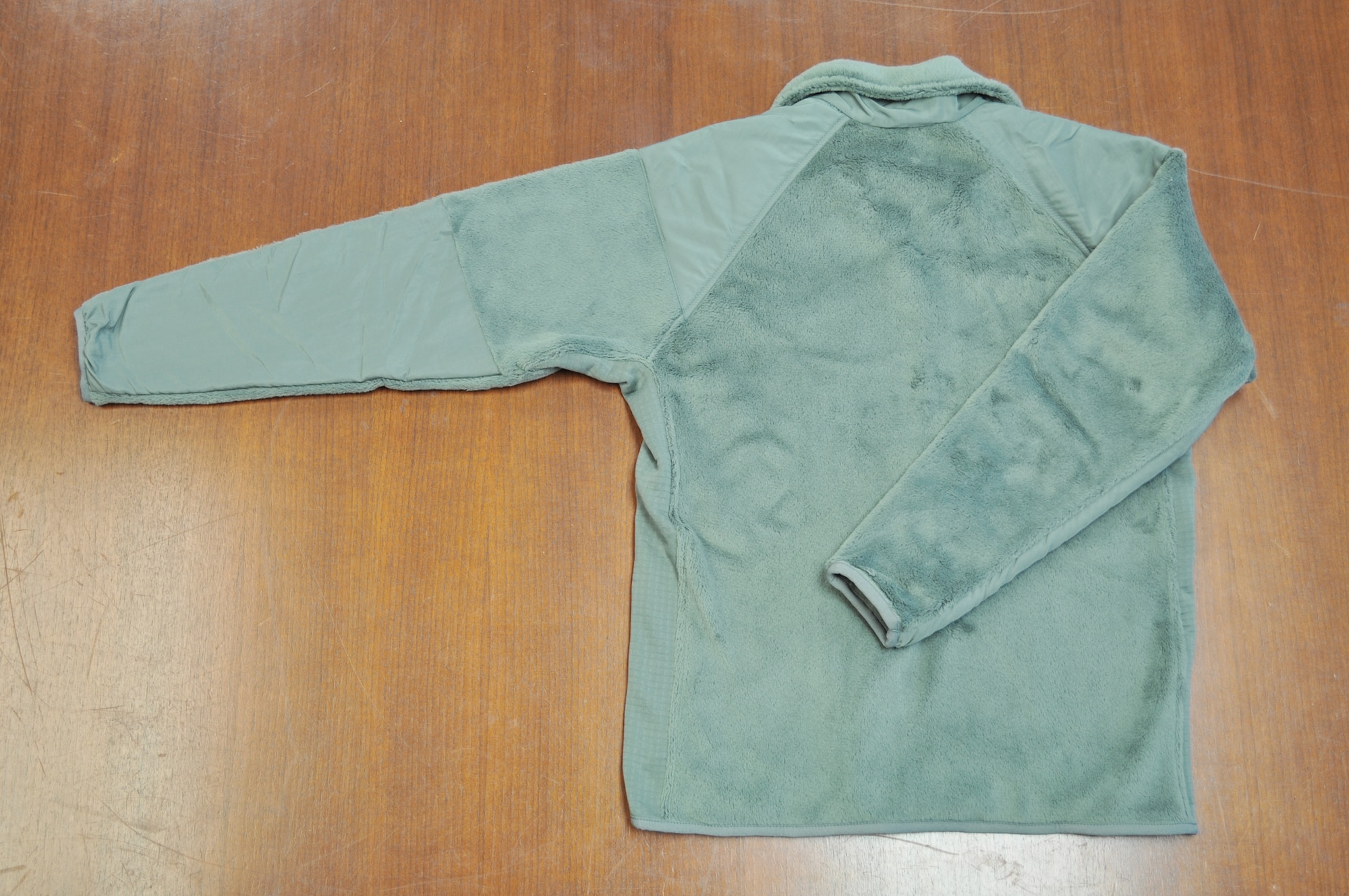 Pictured is the back of the sage green fleece outer garments. Members of the 98th Air Force Virtual Uniform Board released a policy message for wearing the new Air Force sage green fleece as an outer garment for the airman battle uniform. (U.S. Air Force photo) 