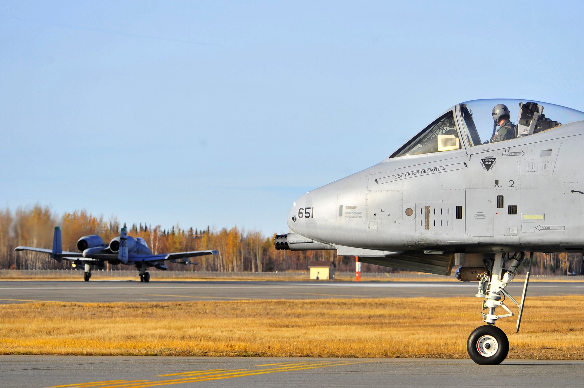 A-10 Thunderbolt II's prepare to launch from the runway during RED FLAG-Alaska 10-1, Oct. 9, 2009, Eielson Air Force Base, Alaska. RF-A is a Pacific Air Forces-directed field training exercise poised at giving aircrews their first 10 flights in simulated air-combat conditions. The A-10's are assigned to Osan Air Base, Republic of Korea. (U.S. Air Force photo/Staff Sgt. Christopher Boitz)