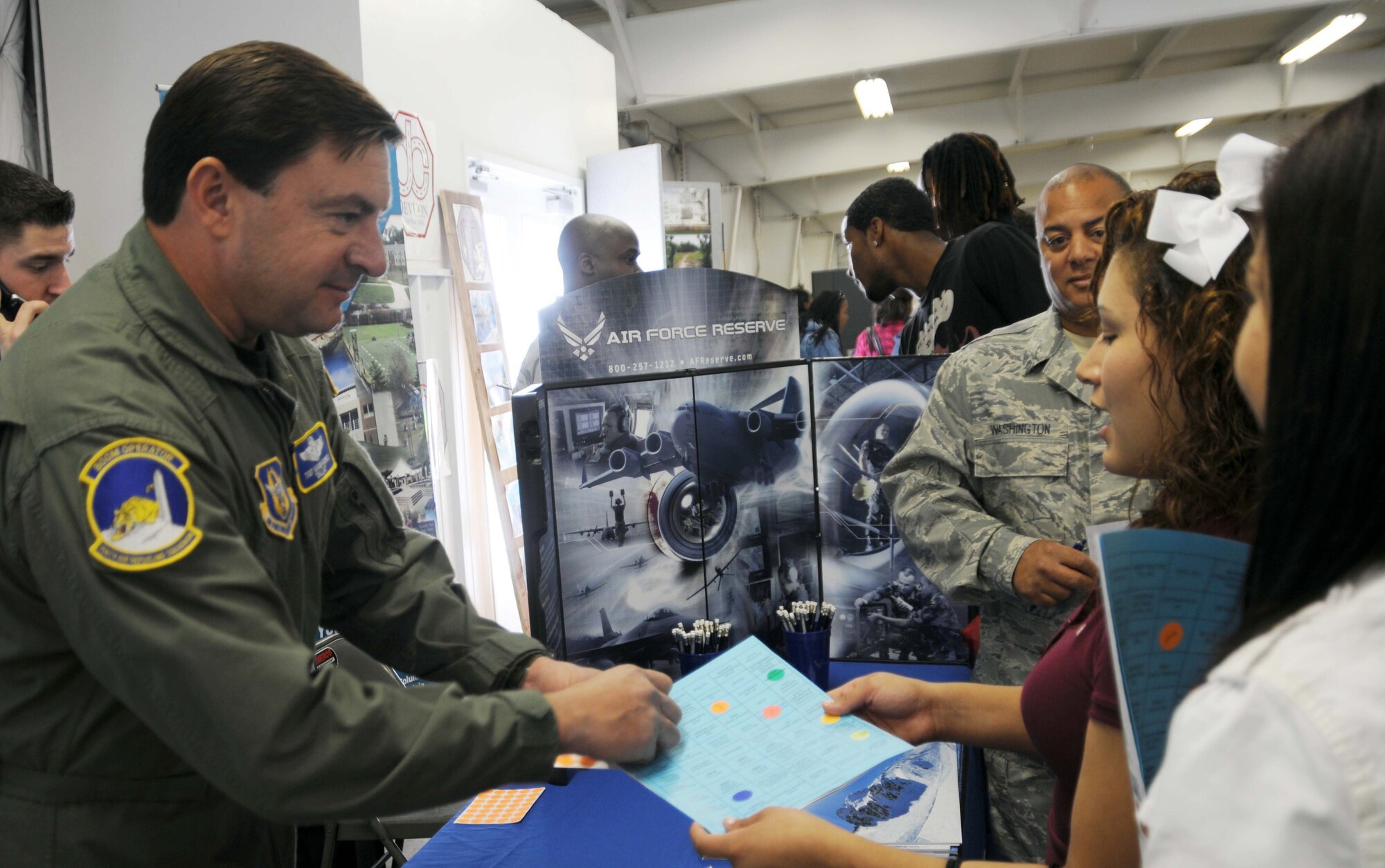 At the Virginia Department of Transportation Career Fair Oct. 8 in Manassas, Virginia, Tech Sgt. Karim Kronfli, a boom operator with the 459th Air Refueling Wing discussed the benefits of enlisting in the Air Force Reserve and his experiences having an office in the sky aboard the KC-135R.  The event hosted more than 700 high school students from Prince William County. (U.S. Air Force Photo/Capt. Rebecca Garcia)