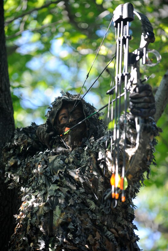 LANGLEY AIR FORCE BASE, Va. - David Hopper, 1st Fighter Wing Public Affairs operations specialist, practices his bow hunting skills here Oct. 8. Participants of bow hunting season, Oct. 3 through Nov. 14, must obtain a state hunting license, qualify on 15 and 25 yards and adhere to all safety rules. (U.S. Air Force photo/ Senior Airman Dana Hill)
