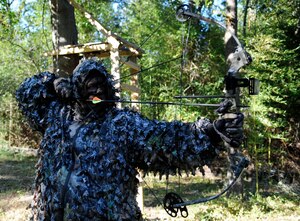 LANGLEY AIR FORCE BASE, Va. - David Hopper, 1st Fighter Wing Public Affairs operations specialist, sights in his bow here Oct. 8.  Participants of bow hunting season, Oct. 3 through Nov. 14, must obtain a state hunting license, qualify on 15 and 25 yards and adhere to all safety rules. (U.S. Air Force photo/ Senior Airman Dana Hill) 
