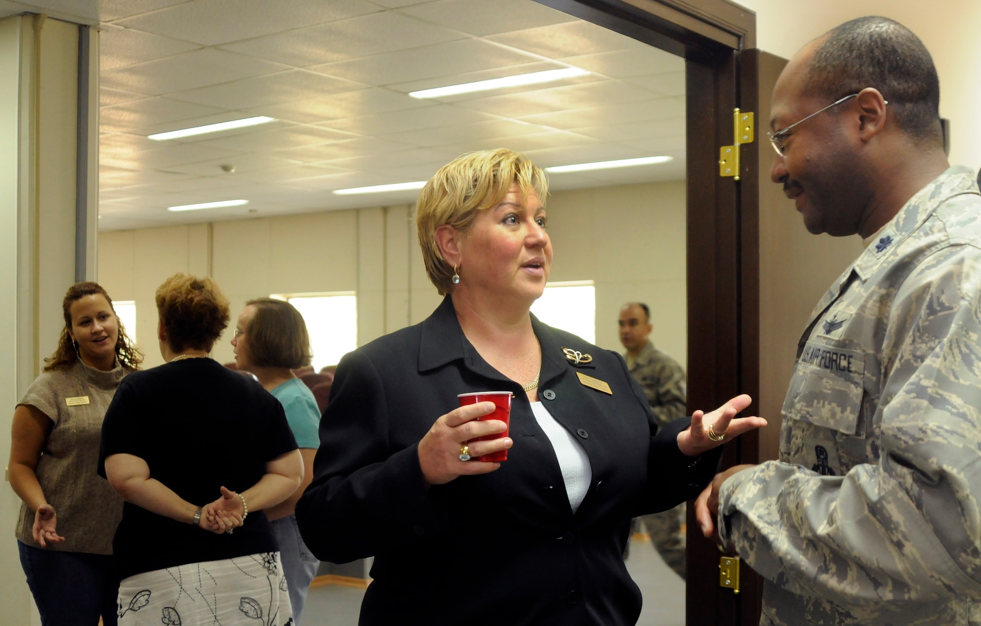 Janet Morrison, 39th Force Support Squadron, force development flight chief, speaks with Lt. Col. Jeffrey Jenkins, 39th Mission Support Group deputy commander, about the new facilities and accommodations the Airman and Family Readiness Center has to offer during its open house, Oct. 9, 2009, at Incirlik Air Base, Turkey. The AFRC has much to offer for the base populace including financial and deployment information, assistance with job searching and resumes and a WiFi hotspot for those without internet. (U.S. Air Force photo/Airman 1st Class Amber Ashcraft)