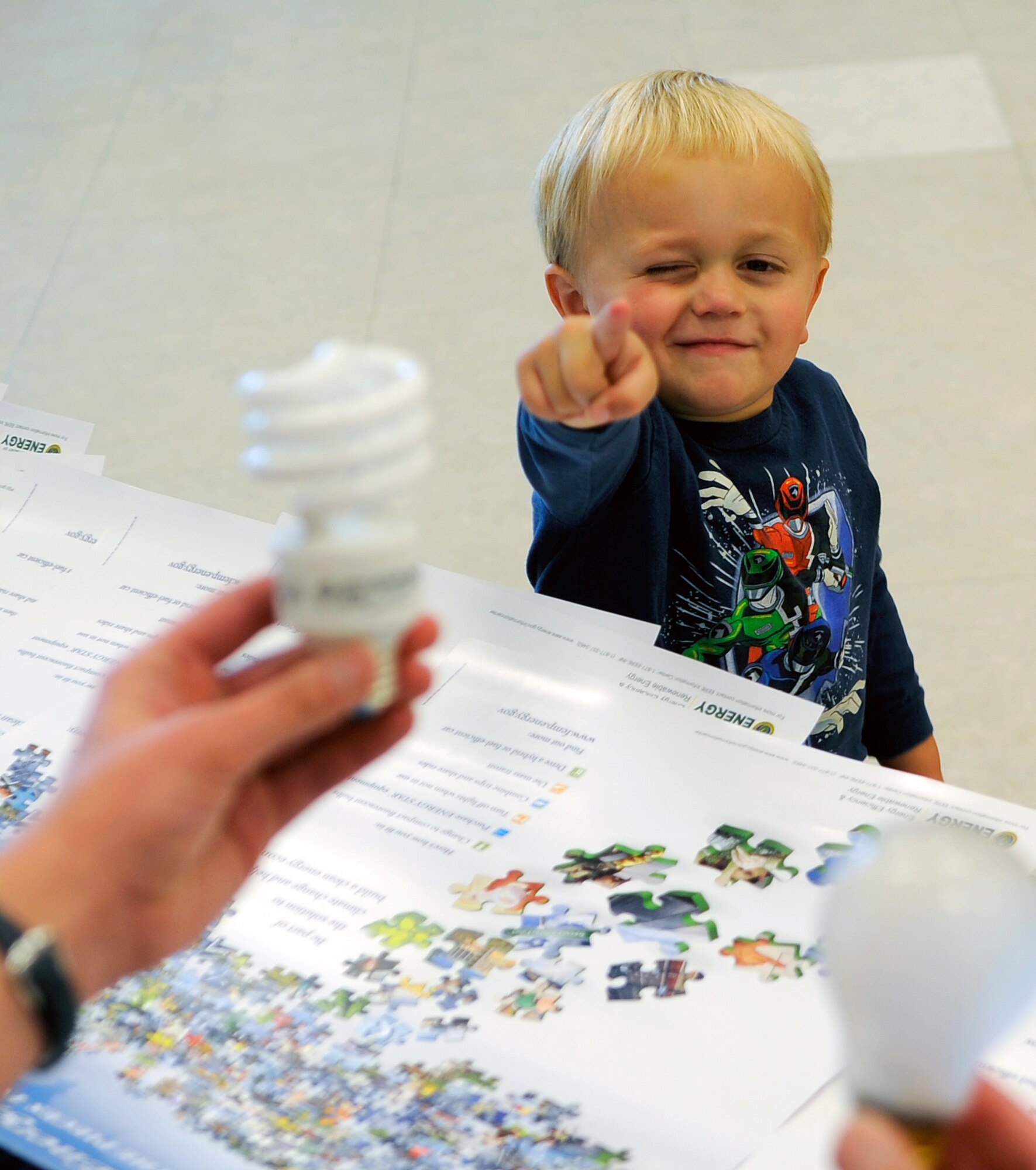 When asked which bulb is more energy efficient, 3-year-old Charlie LeBlanc points to the compact florescent bulb at the Osan AB, Base Exchange. Airmen from the 51st Civil Engineer Squadron brought more than 700 bulbs to give away Oct. 10, but have more than 6000 free bulbs in stock at the self-help store. These bulbs can replace any incandescent bulb in a 110-volt socket. (U.S. Air Force photo/Staff Sgt. Brian Ferguson)





