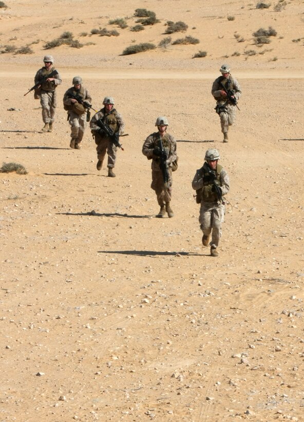 Marines with Lima Company, Battalion Landing Team, 3rd Battalion, 2nd Marine Regiment, 22nd Marine Expeditionary Unit, prepare to clear a house during Exercise Bright Star 2009 in Egypt, Oct. 13, 2009. The multinational exercise is designed to improve readiness, interoperability, and strengthen the military and professional relationships among U.S., Egyptian and participating forces. Bright Star is conducted by U.S. Central Command and held every two years. Elements of the 22nd MEU are currently are participating in the multi-national exercise while serving as the theater reserve force for U.S. Central Command.::r::::n::(Official Marine Corps Photo by Cpl. Justin M. Martinez)::r::::n::