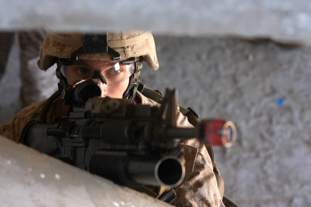 Lance Cpl. Eric Janasiak, a rifleman with Lima Company, Battalion Landing Team, 3rd Battalion, 2nd Marine Regiment, 22nd Marine Expeditionary Unit and native of Branford, Conn., holds security on a staircase during urban training as part of Exercise Bright Star 2009 in Egypt, Oct. 13, 2009. The 22nd Marine Expeditionary Unit is ashore participating in the multi-national exercise while serving as the theater reserve force for U.S. Central Command.::r::::n::(Official Marine Corps Photo by Cpl. Justin M. Martinez)::r::::n::