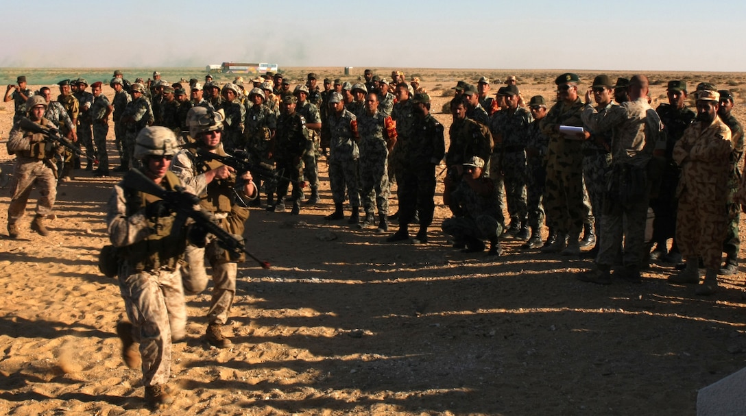 Marines with Lima Company, Battalion Landing Team, 3rd Battalion, 2nd Marine Regiment, 22nd Marine Expeditionary Unit, demonstrate house-clearing operations for Middle Eastern military leaders during Exercise Bright Star 2009 in Egypt, Oct. 13, 2009. The multinational exercise is designed to improve readiness, interoperability, and strengthen the military and professional relationships among U.S., Egyptian and participating forces. Bright Star is conducted by U.S. Central Command and held every two years. Elements of the 22nd MEU are currently are participating in the multi-national exercise while serving as the theater reserve force for U.S. Central Command.::r::::n::(Official Marine Corps Photo by Cpl. Justin M. Martinez)::r::::n::