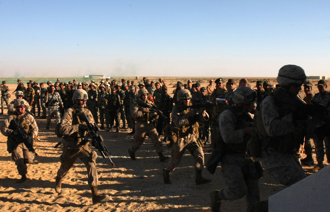 Marines with Lima Company, Battalion Landing Team, 3rd Battalion, 2nd Marine Regiment, 22nd Marine Expeditionary Unit, demonstrate house-clearing operations for Middle Eastern military leaders during Exercise Bright Star 2009 in Egypt, Oct. 13, 2009. The multinational exercise is designed to improve readiness, interoperability, and strengthen the military and professional relationships among U.S., Egyptian and participating forces. Bright Star is conducted by U.S. Central Command and held every two years. Elements of the 22nd MEU are currently are participating in the multi-national exercise while serving as the theater reserve force for U.S. Central Command.::r::::n::(Official Marine Corps Photo by Cpl. Justin M. Martinez)::r::::n::