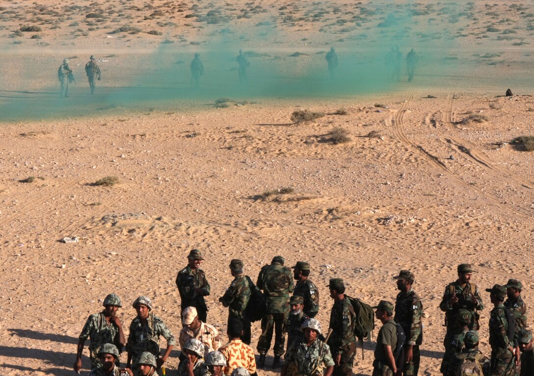Marines with Lima Company, Battalion Landing Team, 3rd Battalion, 2nd Marine Regiment, 22nd Marine Expeditionary Unit, demonstrate house-clearing operations for Middle Eastern military leaders in Egypt during Exercise Bright Star 2009 in Egypt, Oct. 13, 2009. The multinational exercise is designed to improve readiness, interoperability, and strengthen the military and professional relationships among U.S., Egyptian and participating forces. Bright Star is conducted by U.S. Central Command and held every two years. Elements of the 22nd MEU are currently are participating in the multi-national exercise while serving as the theater reserve force for U.S. Central Command.::r::::n::(Official Marine Corps Photo by Cpl. Justin M. Martinez)::r::::n::