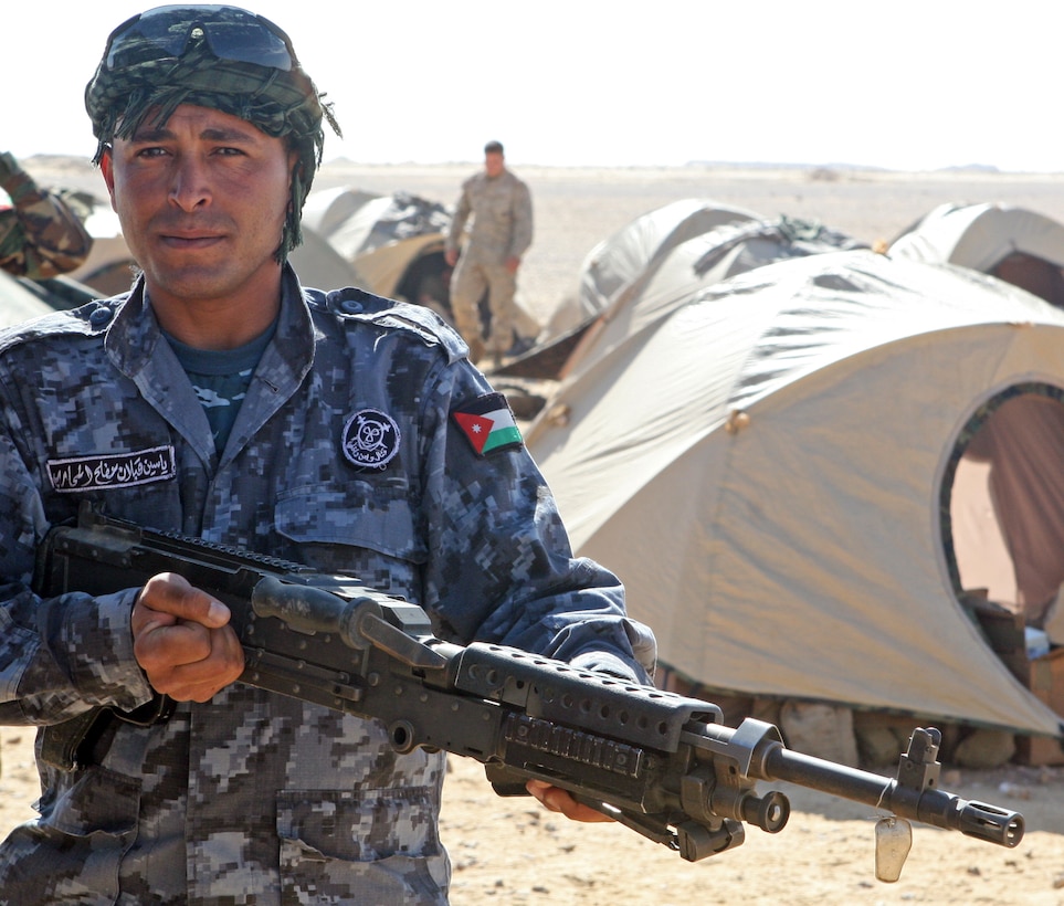A Jordanian commando holds a M240G machine gun during a bilateral weapons exchange as part of Exercise Bright Star 2009 in Egypt, Oct. 13, 2009. The multinational exercise is designed to improve readiness, interoperability, and strengthen the military and professional relationships among U.S., Egyptian and participating forces. Bright Star is conducted by U.S. Central Command and held every two years. Elements of the 22nd MEU are currently are participating in the multi-national exercise while serving as the theater reserve force for U.S. Central Command.::r::::n::(Official Marine Corps Photo by LCpl. David Castillo)::r::::n::