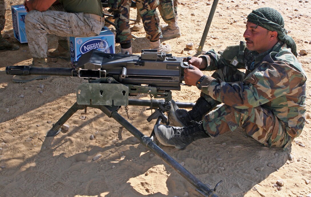 A Jordanian commando sits behind a MK-19 40mm automatic grenade launcher during a bilateral weapons exchange as part of Exercise Bright Star 2009 in Egypt, Oct. 13, 2009. The multinational exercise is designed to improve readiness, interoperability, and strengthen the military and professional relationships among U.S., Egyptian and participating forces. Bright Star is conducted by U.S. Central Command and held every two years. Elements of the 22nd MEU are currently are participating in the multi-national exercise while serving as the theater reserve force for U.S. Central Command.::r::::n::(Official Marine Corps Photo by Lance Cpl. David Castillo)::r::::n::