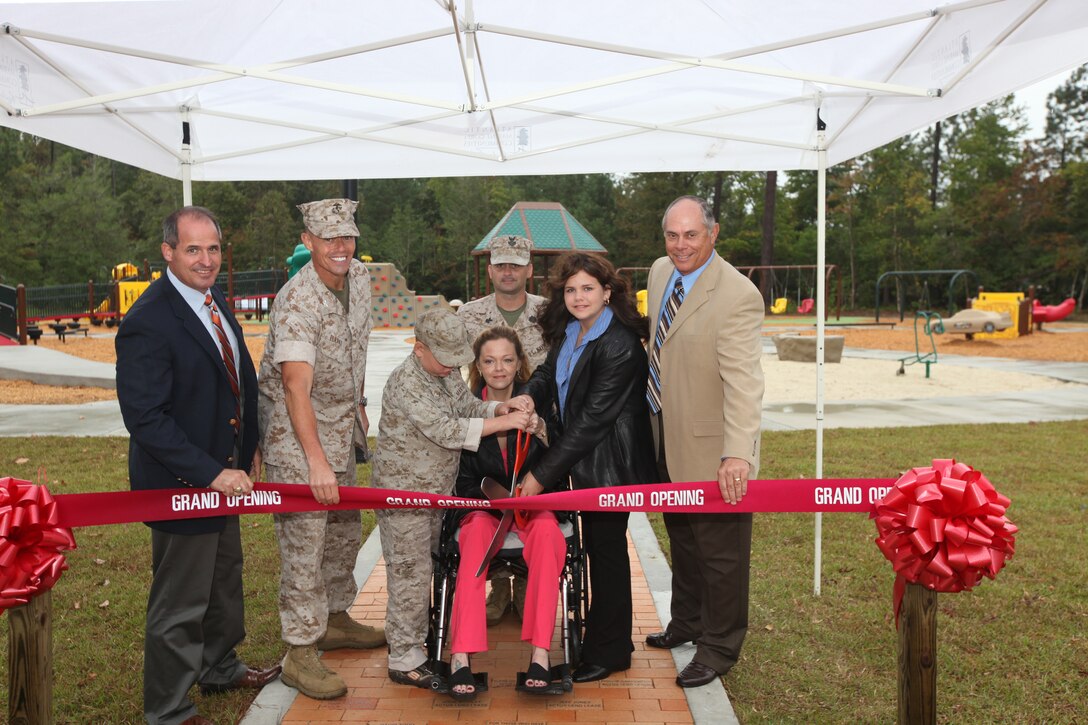 Recently a ribbon cutting ceremony was held by Atlantic Marine Corps Community to officially open the Boundless Playground and Warrior Workout Trail for the Camp Lejeune community. During the ceremony, Marc Sierra, Actus Lend Lease's Portfolio Executive Vice President, Col. Richard P. Flatau Jr., the base commanding officer and Robert Dickerson, retired major general, assisted the Garner family as they cut the ribbon during the grand opening ceremony. This playground is the first of its kind aboard any Marine Corps installation, and allows children and parents with different needs and disabilities to play together in an environment where they feel safe and strong. The playground was built to support children’s development. The Warrior Workout Trail has different fitness equipment staged throughout the trail to allow service members and their families to workout on the equipment along the trail.