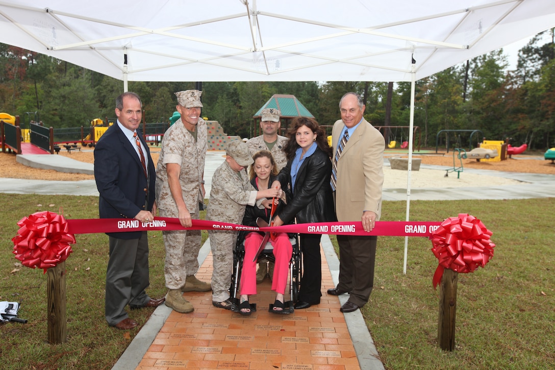 Recently a ribbon cutting ceremony was held by Atlantic Marine Corps Community to officially open the Boundless Playground and Warrior Workout Trail for the Camp Lejeune community. During the ceremony, Marc Sierra, Actus Lend Lease's Portfolio Executive Vice President, Col. Richard P. Flatau Jr., the base commanding officer and Robert Dickerson, retired major general, assisted the Garner family as they cut the ribbon during the grand opening ceremony. This playground is the first of its kind aboard any Marine Corps installation, and allows children and parents with different needs and disabilities to play together in an environment where they feel safe and strong. The playground was built to support children’s development. The Warrior Workout Trail has different fitness equipment staged throughout the trail to allow service members and their families to workout on the equipment along the trail.