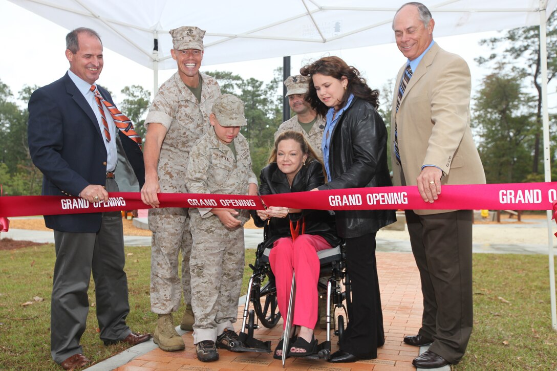 Recently a ribbon cutting ceremony was held by Atlantic Marine Corps Community to officially open the Boundless Playground and Warrior Workout Trail for the Camp Lejeune community. During the ceremony, Marc Sierra, Actus Lend Lease's Portfolio Executive Vice President, Col. Richard P. Flatau Jr., the base commanding officer and Robert Dickerson, retired major general, assisted the Garner family as they cut the ribbon during the grand opening ceremony. This playground is the first of its kind aboard any Marine Corps installation, and allows children and parents with different needs and disabilities to play together in an environment where they feel safe and strong. The playground was built to support children’s development. The Warrior Workout Trail has different fitness equipment staged throughout the trail to allow service members and their families to workout on the equipment along the trail.