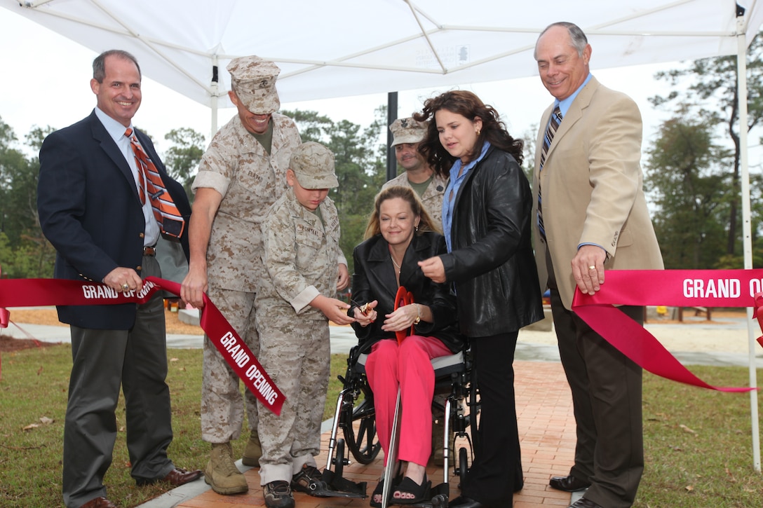 Recently a ribbon cutting ceremony was held by Atlantic Marine Corps Community to officially open the Boundless Playground and Warrior Workout Trail for the Camp Lejeune community. During the ceremony, Marc Sierra, Actus Lend Lease's Portfolio Executive Vice President, Col. Richard P. Flatau Jr., the base commanding officer and Robert Dickerson, retired major general, assisted the Garner family as they cut the ribbon during the grand opening ceremony. This playground is the first of its kind aboard any Marine Corps installation, and allows children and parents with different needs and disabilities to play together in an environment where they feel safe and strong. The playground was built to support children’s development. The Warrior Workout Trail has different fitness equipment staged throughout the trail to allow service members and their families to workout on the equipment along the trail.