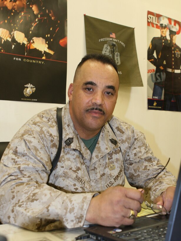 First Sgt. Viriato B. Sena, the company first sergeant for Transportation Support Company, Combat Logistics Battalion 46, poses for a picture in his office aboard Al Asad Air Base, Iraq, October 13, 2009.  Sena, who joined the Marine Corps in 1973, was participated in the evacuation of Vietnam and is now deployed to Iraq for a similar mission, the responsible drawdown of U.S. forces and equipment in Iraq. (U.S. Marine Corps photograph by Lance Cpl. Melissa A. Latty)