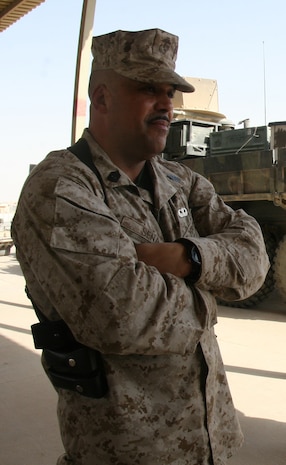 First Sgt. Viriato B. Sena, the company first sergeant for Transportation Support Company, Combat Logistics Battalion 46, stands before his Marines prior to conducting video shout outs aboard Al Asad Air Base, Iraq, October 13, 2009.  Sena, who joined the Marine Corps in 1973, was participated in the evacuation of Vietnam and is now deployed to Iraq for a similar mission, the responsible drawdown of U.S. forces and equipment in Iraq. (U.S. Marine Corps photograph by Lance Cpl. Melissa A. Latty)