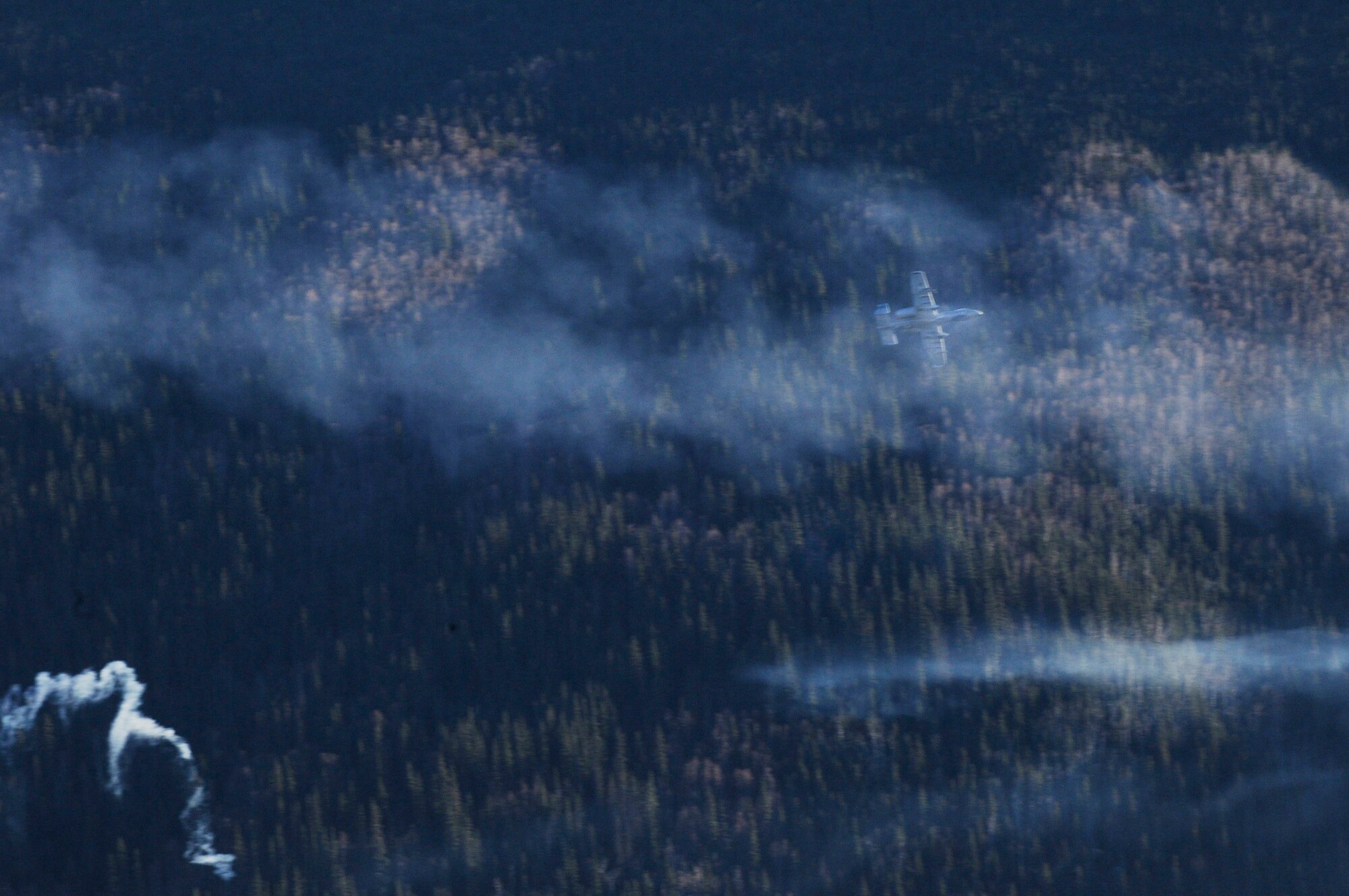An A-10 Thunderbolt II performs a target practice exercise with their 30mm Gatling gun using practice rounds during RED FLAG-Alaska 10-1 Oct. 12, 2009 Eielson Air Force Base, Alaska. This exercise provides unique opportunities to integrate various forces into joint, coalition and bilateral training from a simulated forward operating base. After the A-10 fires the Gatling gun, sensors in the ground where the target is located count hits for training evaluation. The A-10 is assigned to Osan Air Base, Republic of Korea. (U.S. Air Force photo/Airman 1st Class Laura Goodgame)