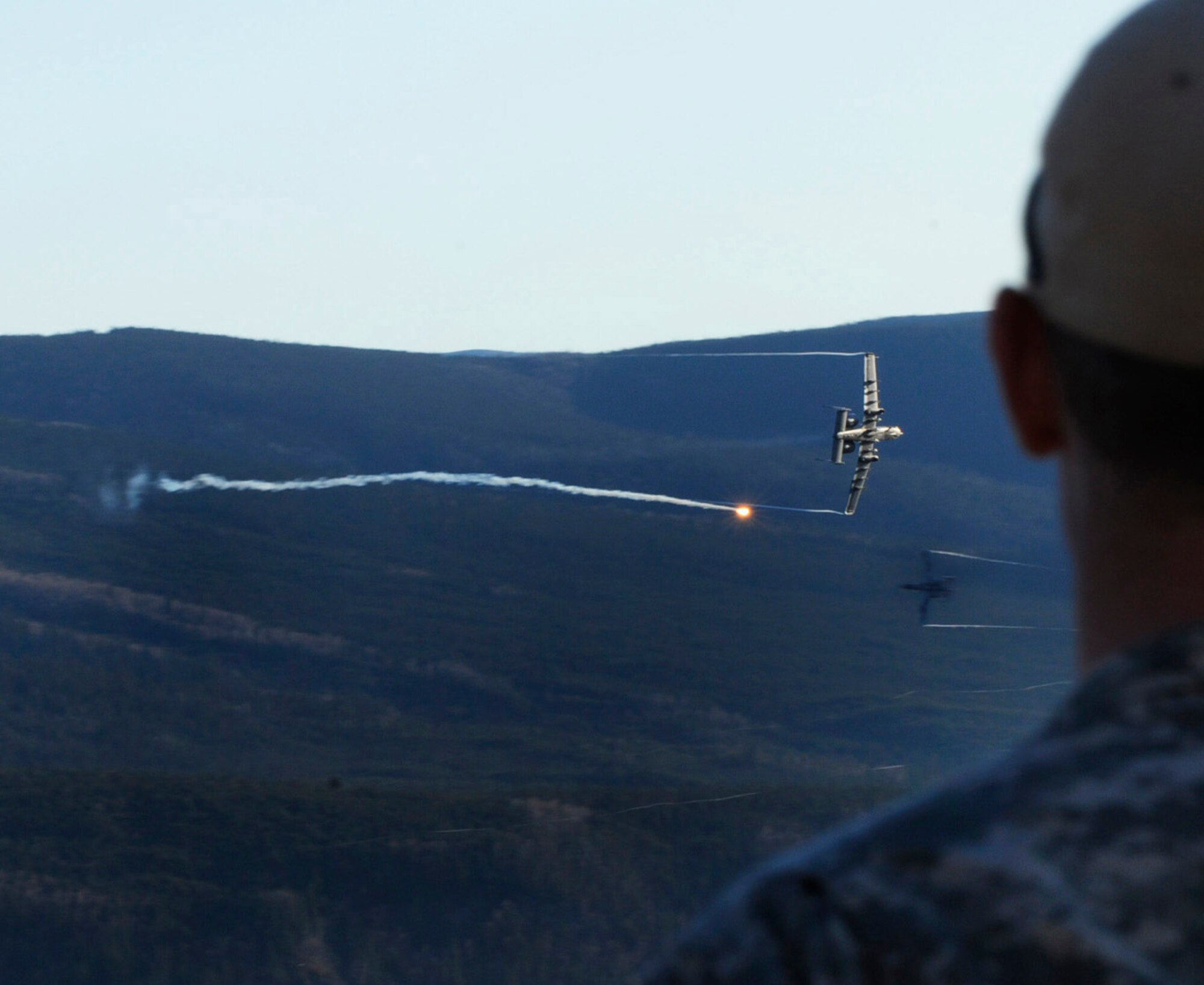 A U.S. Army Soldier makes visual contact with A-10 Thunderbolt II's  during close-air-support missions down range during RED FLAG-Alaska 10-1 Oct. 12, 2009 Eielson Air Force Base, Alaska. This exercise provides unique opportunities to integrate various forces into joint, coalition and bilateral training from a simulated forward operating base. The Soldier is assigned to the Operation Detachment Alpha, 326, 3rd Battalion, 1st Special Forces Group Airborne, Fort Lewis, Wash. The A-10's are assigned to Osan Air Base, Republic of Korea. (U.S. Air Force photo/Airman 1st Class Laura Goodgame)