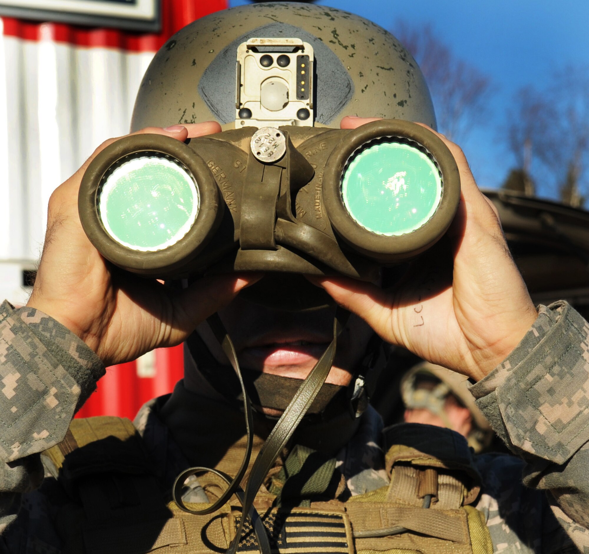 U.S. Army Staff Sgt. Carl Roush identifies ground targets for close-air-support missions down range during RED FLAG-Alaska 10-1 Oct. 12, 2009 Eielson Air Force Base, Alaska. This exercise provides unique opportunities to integrate various forces into joint, coalition and bilateral training from a simulated forward operating base. Sergeant Roush is assigned to the Operation Detachment Alpha, 326, 3rd Battalion, 1st Special Forces Group Airborne, Fort Lewis, Wash.(U.S. Air Force photo/Airman 1st Class Laura Goodgame)