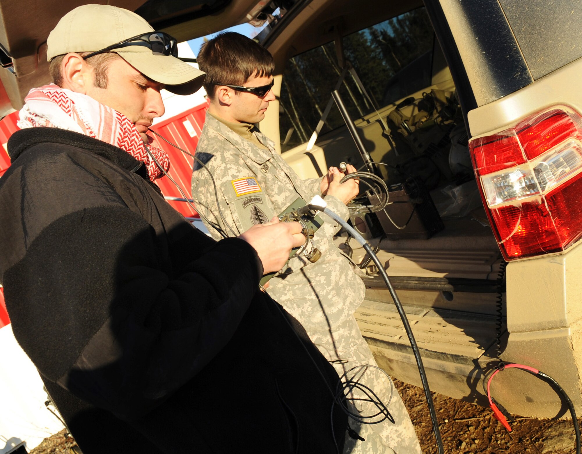 U.S. Army Staff Sgts  Dan Line and Carl Roush set up satellite radio communications in preparation of close-air-support missions during RED FLAG-Alaska 10-1 Oct. 12, 2009 Eielson Air Force Base, Alaska. The soldiers advise commanders on the capabilities and employment of air power, ensure synchronization into the ground commanders' battle plan, and provide terminal attack control for close-air-support missions. Sergeants Line and Roush are assigned to the Operation Detachment Alpha, 326, 3rd Battalion, 1st Special Forces Group Airborne, Fort Lewis, Wash. (U.S. Air Force photo/Airman 1st Class Laura Goodgame)