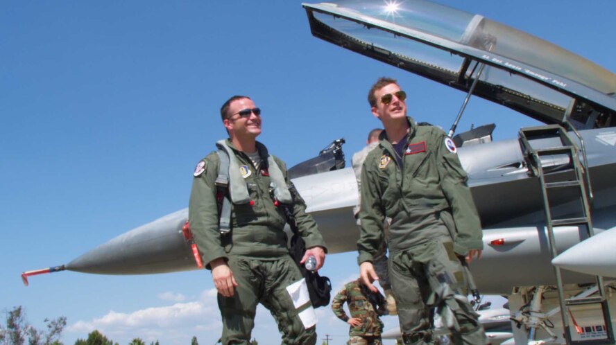 Professional skateboarder Rob Dyrdek and Air Force Reserve F-16 pilot Maj. Jason Smith are ready to talk to the cameras just minutes after landing at March Air Reserve Base, Sept. 10, 2009. Dyrdek, the star of MTV’s reality television program "Rob Dyrdek’s Fantasy Factory," spent much of the week preparing for the flight. With Dyrdek in the rear seat of the F-16, Major Smith executed a refueling with a 336th Air Refueling Squadron KC-135 Stratotanker while Dyrdek’s co-star, Chris “Drama" Pfaff, aboard the KC-135, watched from the boom pod. 