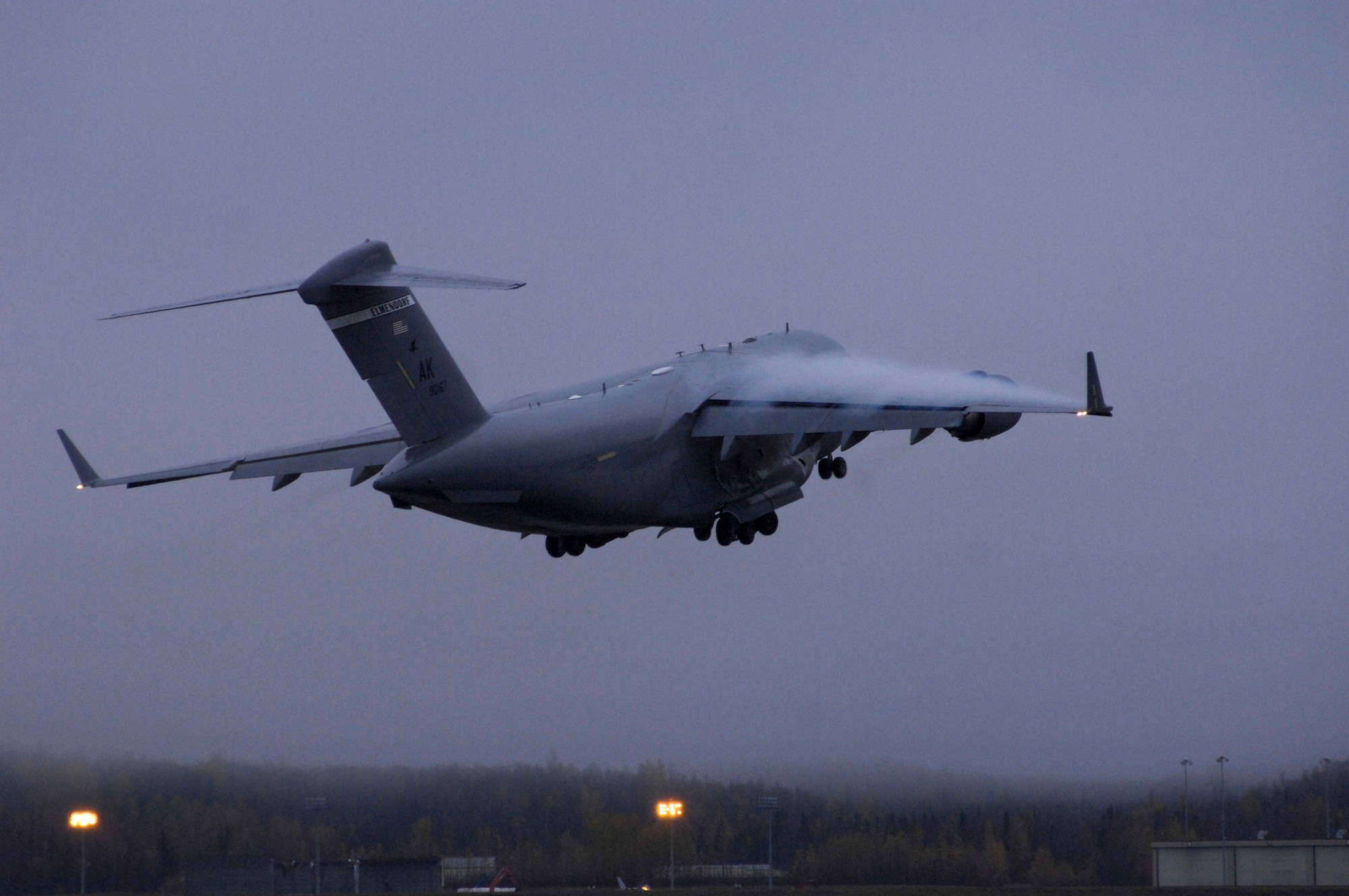 ELMENDORF AIR FORCE BASE, Alaska -- An Elmendorf Globemaster III takes off Oct. 8 during Red Flag-Alaska 10-01. Red Flag-Alaska is a Pacific Air Forces directed field training exercise for U.S. forces, flown under simulated air combat conditions. It is conducted on the Joint Pacific Alaskan Range Complex with air operations flown out of Eielson and Elmendorf Air Force bases. (U.S. Air Force photo/Airman 1st Class Christopher Gross)