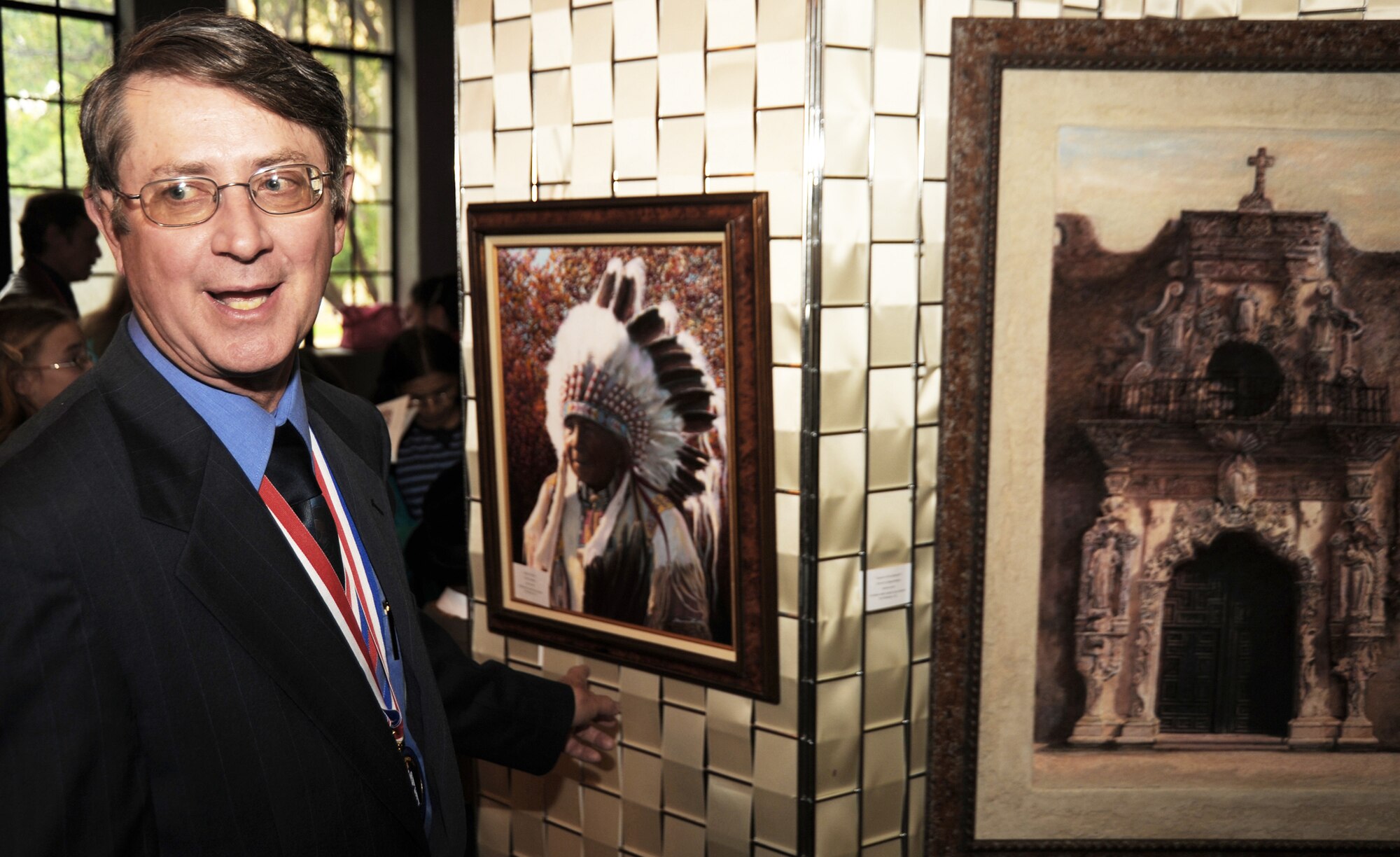 Retired Air Force Lt. Col. Dennis Linn displays his artwork during the 2009 National Veterans Creative Arts Festival Oct. 11, 2009, at the San Antonio Municipal Auditorium in San Antonio. Colonel Linn created an acrylic painting of is friend, Lakota Chief David Bald Eagle. 