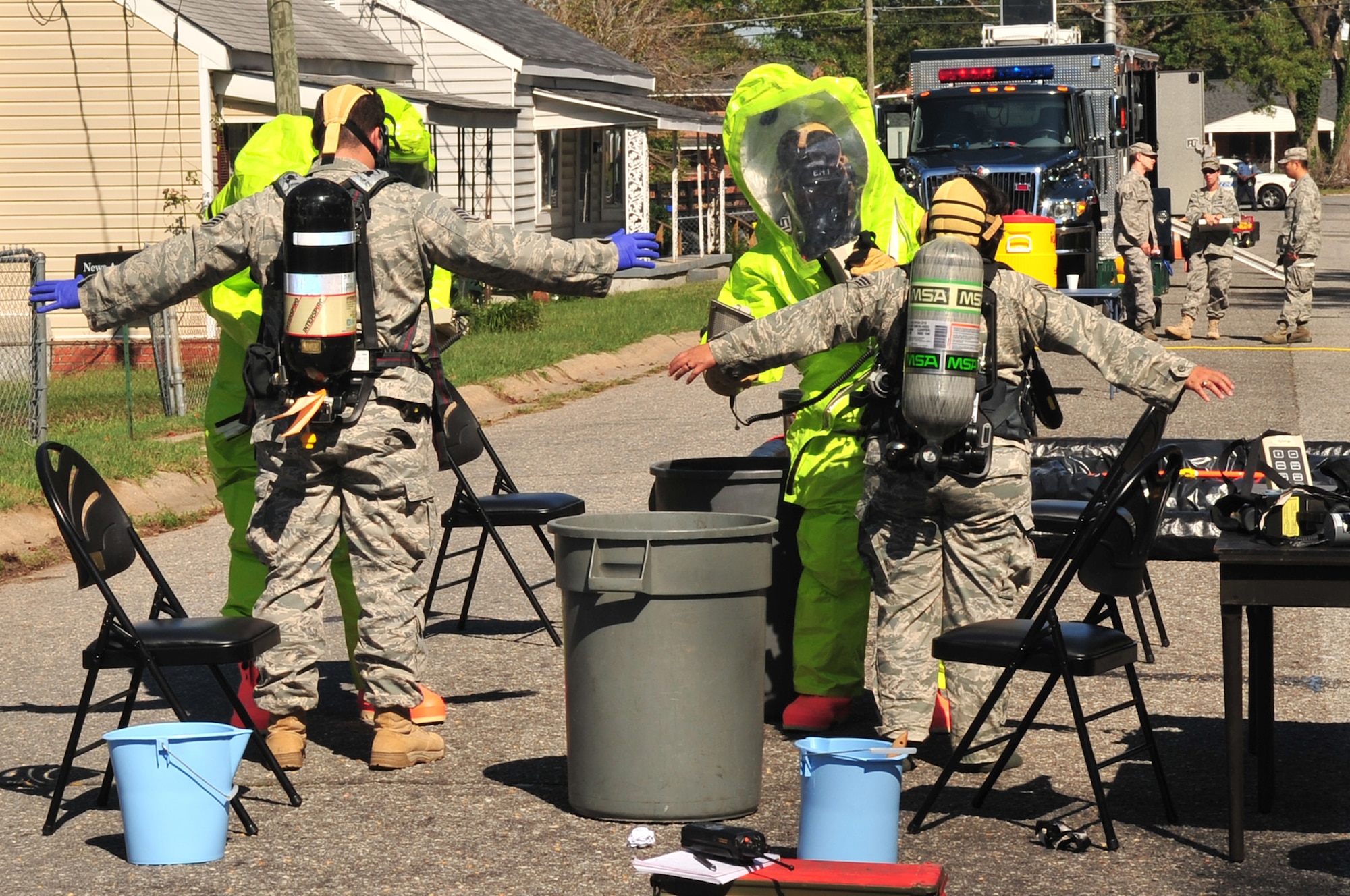 Airmen from 4th Civil Engineer Squadron emergency management flight decontaminate emergency responders during exercise Orbit Comet in Goldsboro, N.C., Oct. 13. During the exercise, Seymour Johnson Airmen responded to a request for assistance from the Goldsboro Police Department, As part of the exercise, explosive ordnance disposal Airmen examined a home containing simulated bomb making material. (U.S. Air Force photo/Airman 1st Class Rae Perry) 