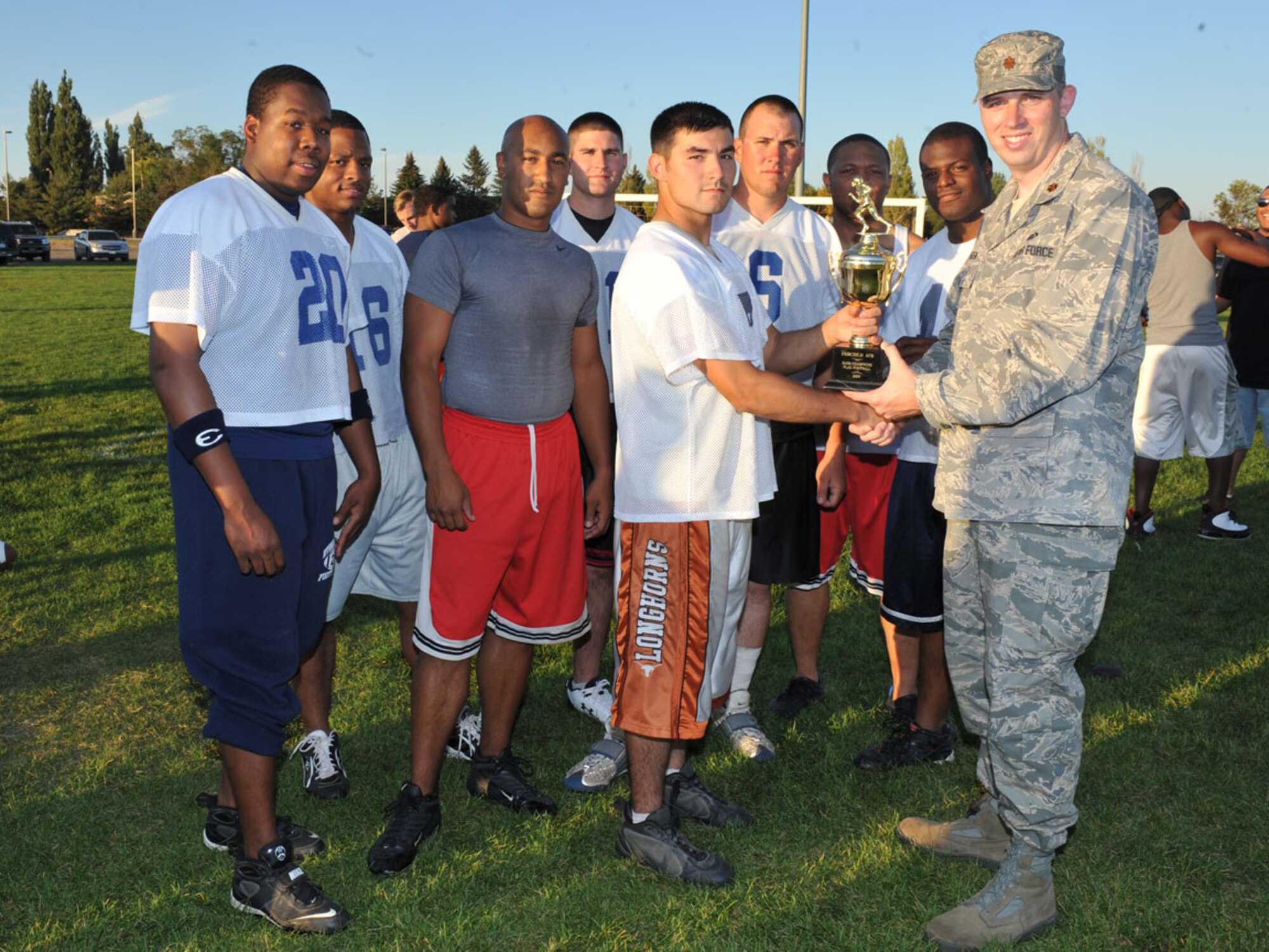92nd Civil Engineering Squadron pose for a group  photo after defeating  the 92nd Medical Group 35-6  on Sept 26.  (U.S. Air Force photo / Staff Sgt. JT May III)