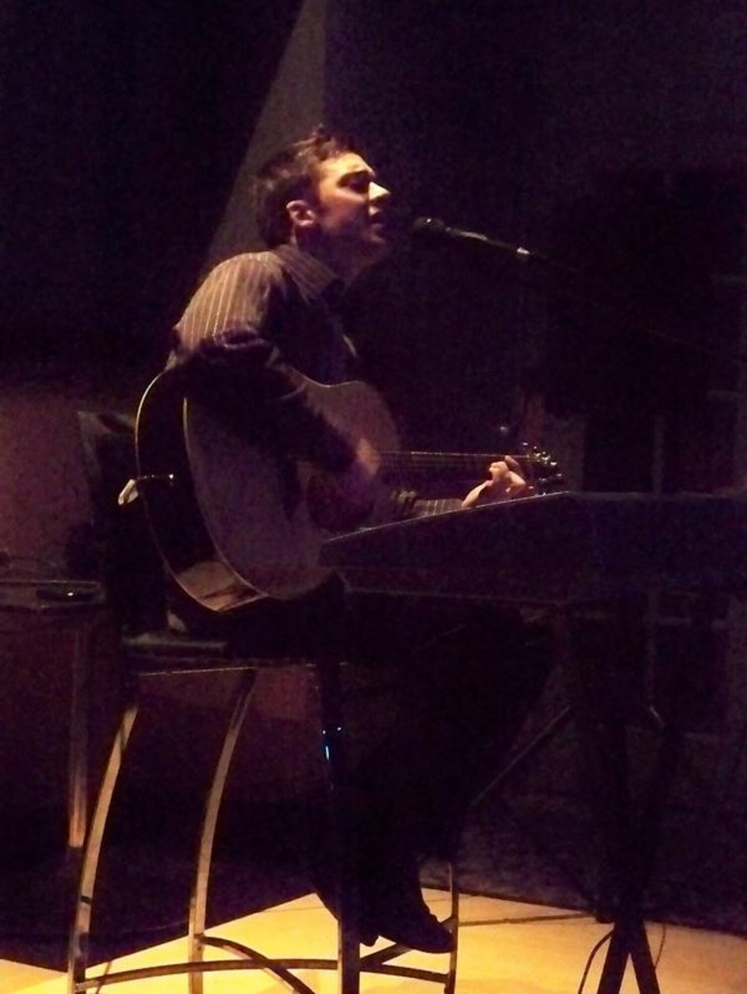 Senior Airman Matt Baumann performs a mix of original and cover songs during a live performance in downtown Spokane.