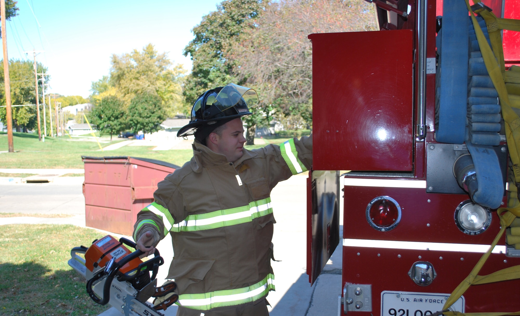 OFFUTT AIR FORCE BASE, Neb. -- Firefighter Lucas Lechtenberg of the 55th Civil Engineer Squadron, seen here performing an equipment check, was recently named Offutt's Firefighter of the Year. During a ceremony at the Offutt Fire House, 55th Wing Vice Commander, Col. John T. Rauch, presented Mr. Lechtenberg with his trophy. U.S. Air Force Courtesy Photo