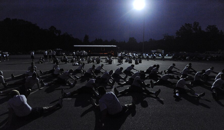 MOODY AIR FORCE BASE Ga. -- Airmen from the 820th Security Forces Group, 93rd Air Ground Operations Wing, a tenant wing at Moody, and the current Airmen Leadership School class take time to stretch before the Airman 1st Class Leebernard Chavis memorial workout here Oct. 14. Airman  Chavis was assigned to the 820th SFG and was killed in action in 2006. (U.S. Air Force photo by Airman 1st Class Joshua Green)