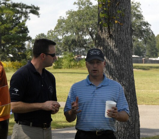 Col. John Wood talks with Maj. Adam Tufts during the 437th Airlift Wing Golf Tournament at Wrenwoods Golf Course here Oct. 9. The wing-wide tournament was a first for Charleston AFB and is planned to be held annually. Colonel Wood is the 437 AW commander and Major Tufts served as the organizer for the event and is the chief of standardization and evaluation for the 14th Airlift Squadron. (U.S. Air Force photo/Staff Sgt. Daniel Bowles)