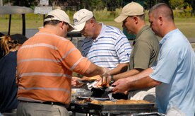 Hungry golfers fill their plates after more than four hours of golf during the 437th Airlift Wing Golf Tournament at Wrenwoods Golf Course here Oct. 9. After golfers played the course, barbeque was served for lunch followed by the naming of the winners. (U.S. Air Force photo/Staff Sgt. Daniel Bowles)