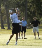Col. Don Shaffer hits a golf ball down the fairway at the start of the 437th Airlift Wing Golf Tournament at Wrenwoods Golf Course Oct. 9. Colonel Shaffer is the 437 AW vice commander and his teammates were Col. John Wood, 437 AW commander, and civic leaders Jim Geffert and Dewitt Zemp. (U.S. Air Force photo/Staff Sgt. Daniel Bowles)