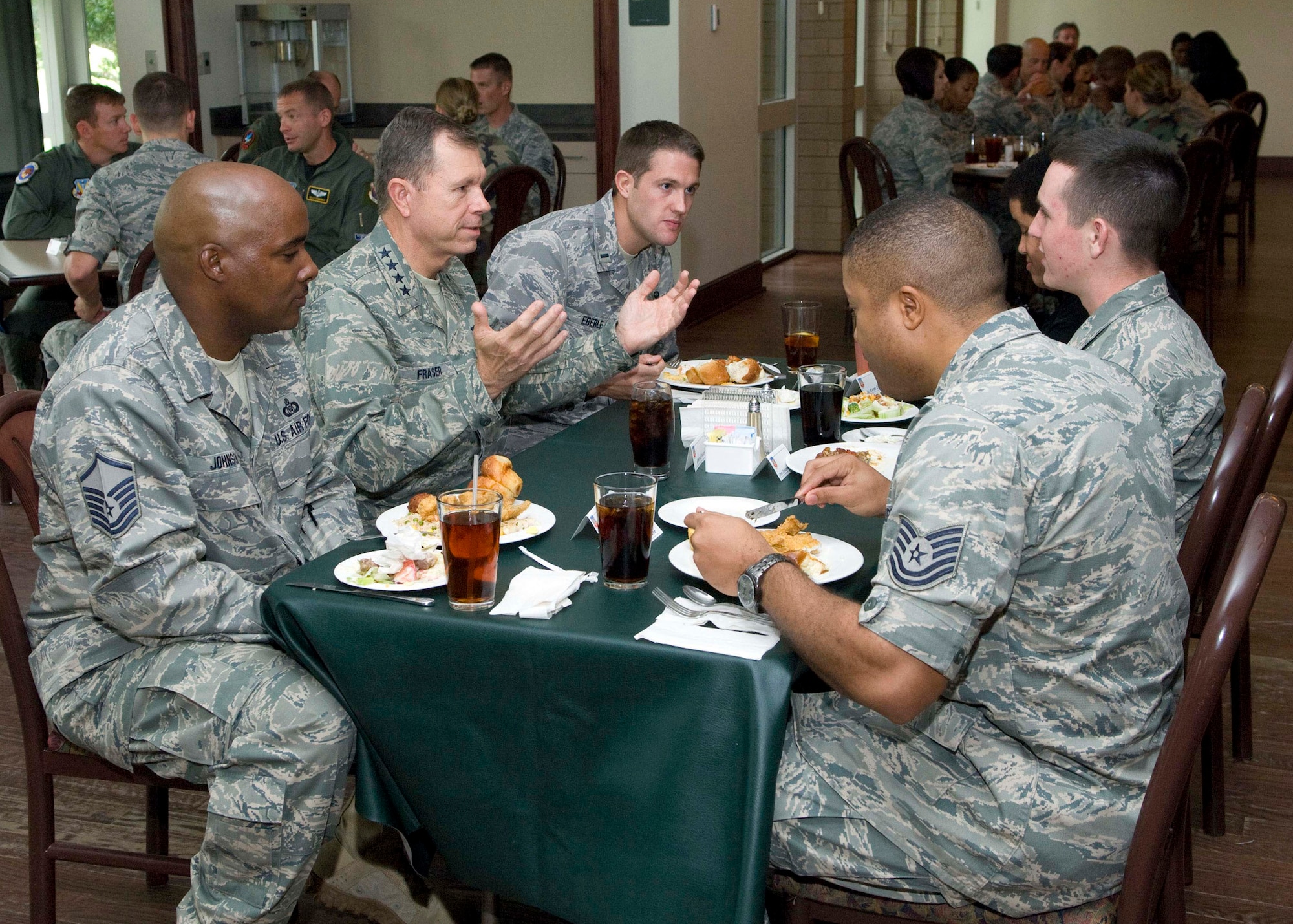 Gen. William Fraser, Air Combat Command commander, discusses issues with 53rd Wing Airmen of all ranks at a luncheon Oct. 13 during his visit to Eglin Air Force Base, Fla.  The general toured the base and learned about how Eglin’s testing and training directly impacts the mission he leads at ACC.  (Air Force photo/Bruce Hoffman.)