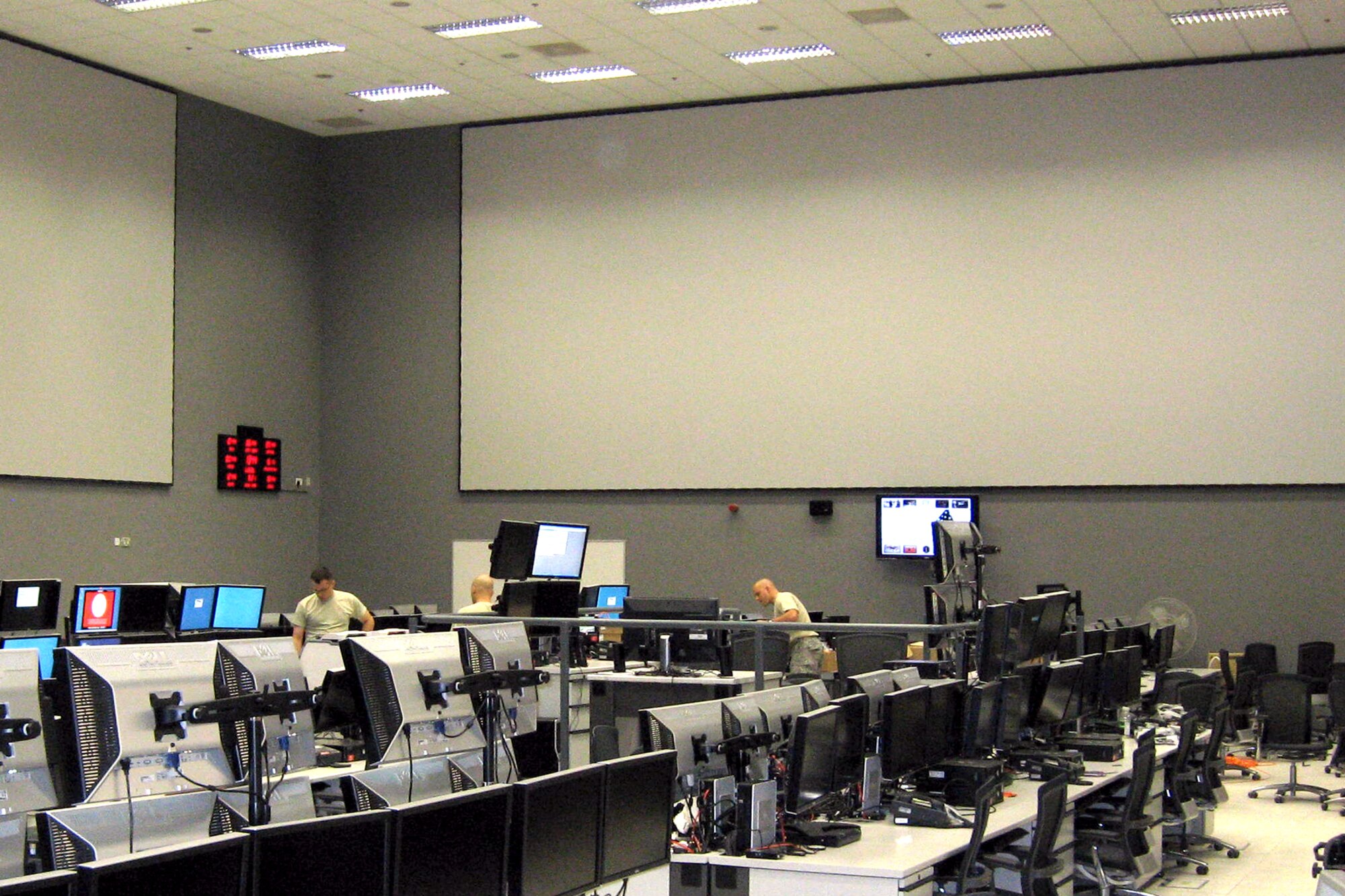 Airmen put finishing touches on the installation of equipment at the brand new, state-of-the-art combined air and space operations center, or CAOC, in Southwest Asia.  A team from the Electronic Systems Center, headquartered at Hanscom Air Force Base, Mass., led the effort to equip, modernize and streamline operations in the new center.
(Courtesy Photo)